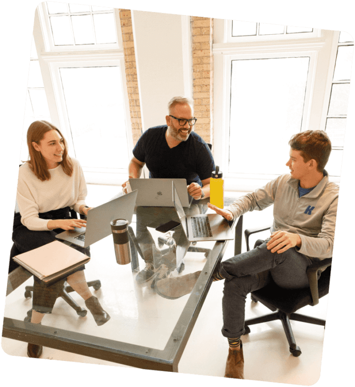 Kaleidoscope team talking around a table