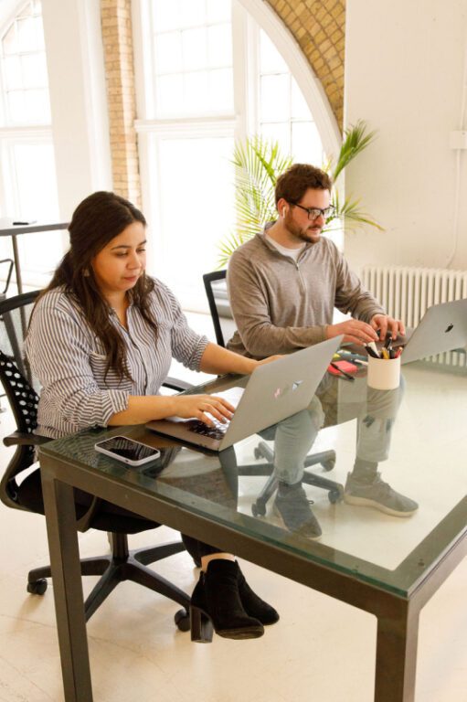 Woman and man working at an office