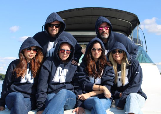 Group of people in sweatshirts smiling