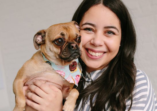 Woman smiling with her dog