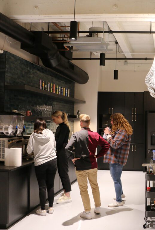 Group of people at work at a coffee bar