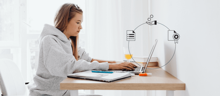 Student with a laptop and notebook