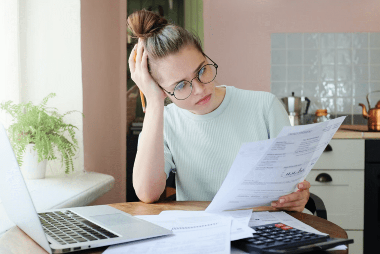 Woman working at a kitchen table